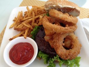 Western burger: BBQ Gardein patty, lettuce, pineapples, onion rings, & vegan mayo on a sesame seed bun. Delicious! at Loving Hut in Phoenix