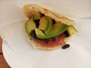 Delicious vegan arepa with beans, tomato and avocado at Bar Savoy in La Palma