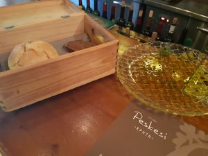 Freshly baked bread and olive oil plate at Peskesi in Crete