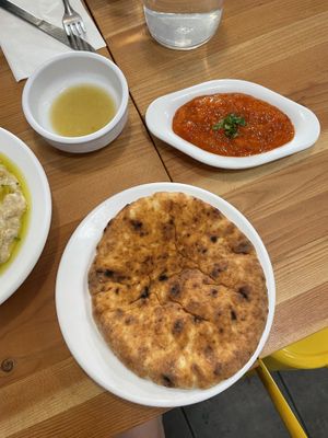 Harissa, tatbila, fluffy pita  at Aviv Hummus Bar in Seattle