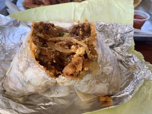 Soyrizo burrito cut open. I could only eat half because it’s so big. And I got nachos, but still.  at Garduno's Taco King in Baldwin Park