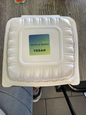 Clearly labeled vegan to go box  at Pots N Woks in Whittier