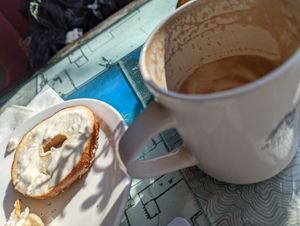 Bagel with cream cheese and soy latte in a mug 🥳 at Just Bob in Portland