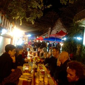 Eat at a communal table down the side street. at Hmong Night Market in Luang Prabang