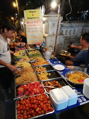 I have to say and correct a bit of information for this vegan buffet stall at the night Market. He is on his own and there's a lot of bench to sit down and enjoy.  at Hmong Night Market in Luang Prabang