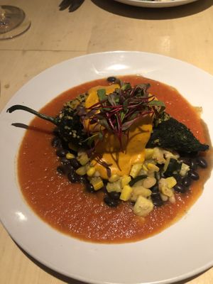 Vegan Chile Relleno stuffed with quinoa, black beans, zucchini, and corn topped with cashew queso   at Blue Heron Restaurant in Santa Fe