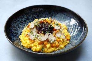 Pumpkin risotto and fresh black truffle at The Meets Restaurant in Amsterdam