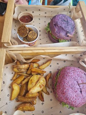 Delicious 2 different burgers and fries and spicy sauce and Flower Bombs 🥰 at Flower Burger in Bari