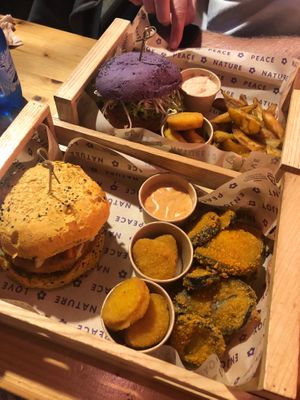 The flower burger (purple) and the funny cripsy (yellow) burgers. Nuggets, fried eggplant potatoe wedges at Flower Burger in Bari