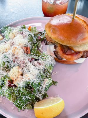 Mozza melt burger with side Caesar salad at Nateure's Plate in Peterborough