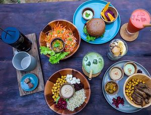 Falafel burger, mango chutney salad, middle east salad, sharing is caring. Juices and french press coffee. at Nourish in Hoi An
