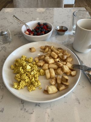 Tofu scramble, potato’s, fruit and coffee.  at The Informalist in Eau Claire