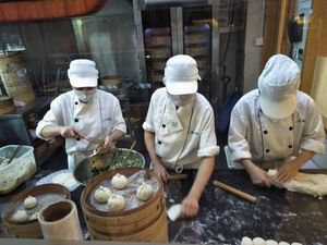 Staff making baozi, fascinating and they are delicious. at Táiwān RénDào SùCài in Shanghai