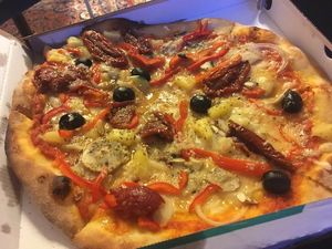 Azzuras no. 4 vegetarian pizza made vegan by switching the cheese to vegan cheese - and with sundried tomatoes and olives instead of asparagus.
 at Azzurra Nordkraft in Aalborg