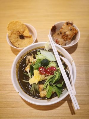 Assam laksa with slurpilicious thick gravy. Top left is crispy wonton and top right is their special carrot cake. at Thunder Tree 擂茶树 - VivoCity in Central Singapore