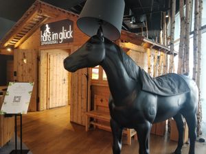 Black horse at entrance at Hans im Glück - Vivocity  in Central Singapore