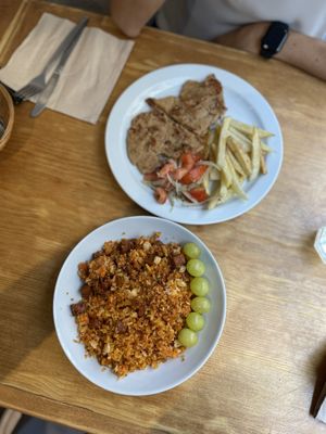 Segundos del menú del día: migas con chorizo vegano y legimbreta con tomate y patatas  at La Piparra in Bilbao