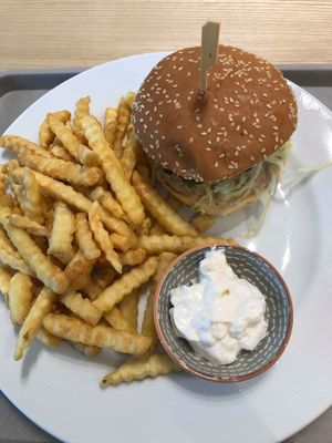 Burger with fries and vegan mayo. A big portion of fries that were pretty good and the burger itself was satisfying.  at Loving Hut - Zlicin in Prague