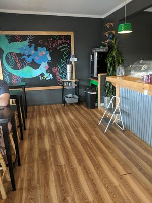 Sitting area with bar to right at The Spot in Kapaa