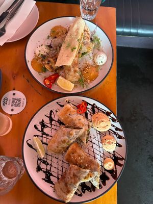 Smoked butter chicken roti rolls (Top) and duck roti rolls (bottom) at Tyranny of Distance in Windsor