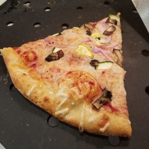 Cold slice of pizza that was sitting too long at Whole Foods Market in Sedona