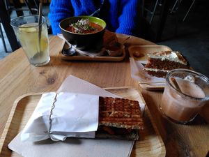 From top left clockwise: ginger tea, tomato soup, carrot cake, purple rain, fake chicken sandwich at Mr. Morris in Tilburg