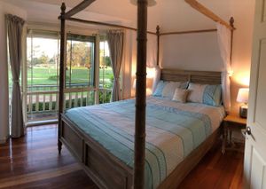 The Bay Window Room features a romantic four poster bed. at Hilltop Hooves in Romsey