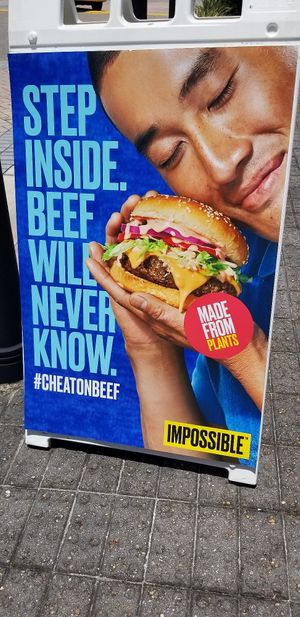Promoting the Impossible Burger out front. Love it. at Hot Krust in Orlando