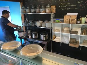 Nathan prepares my salad bowl at Providence NZ in Dargaville