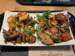 Protein dense plate full of different kinds of tofu, vegetables and flavors. at Sattgrün Kolumba Viertel - Mitte in Cologne