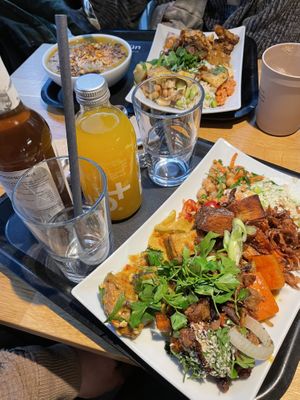 Sweet potato soup and two regular size plates wish a lot of mixed options from their menu  at Sattgrün Kolumba Viertel - Mitte in Cologne
