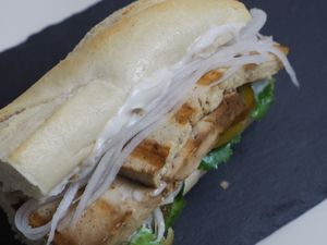 Bahn Mi Sandwich. Vietnamese style sandwich in a baguette with marinated warm tofu, vegan Mayonnaise, Hoisin sauce, pickled mooli radish, jalapeños and coriander. at Vegetate in Aylesbury