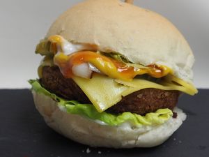 Beyond Burger with vegan Cheese, fried onion, lettuce, tomato ketchup and mustard and vegan mayonnaise. at Vegetate in Aylesbury