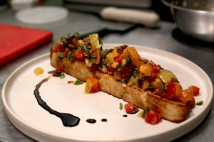 Bruschetta featuring Roots Farm Organic Heirloom Tomatoes and OAT Bakery Superfood Ciabatta Bread! (Gluten Free available too!) at Satellite in Santa Barbara