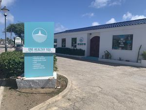 Entrance - small signage  at One Happy Bowl in Noord