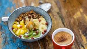 Our coconut yoghurt bowl with homemade granola & fresh fruits. Combine it with an oat milk cappuccino! at One Happy Bowl in Noord