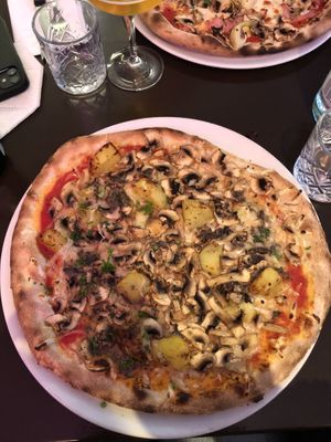 Excellent vegan truffle Pizza with truffle Creme, champignons, potatoes and fresh herbs😍  at MammaMia in The Hague