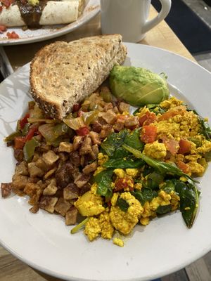 Tofu breakfast scramble with home fries and multigrain toast  at Green Eggs Cafe - Midtown Village in Philadelphia