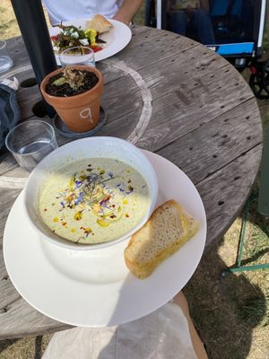 Gazpacho w foccacia. On orgel side of table bbq veggies w wheat and cheese at Jord & Bord Örnahusen in Borrby