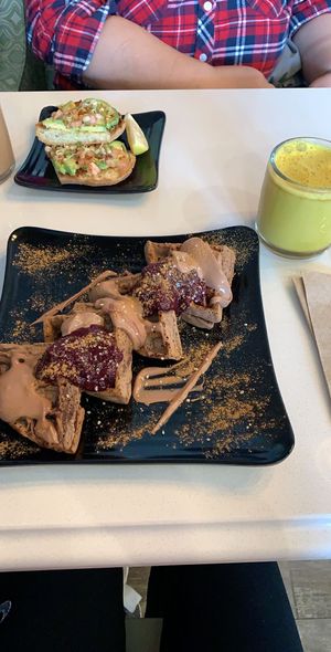 avocado toast, blueberry cacao waffles, and turmeric latte  at Copper Branch - Mavis Rd  in Mississauga