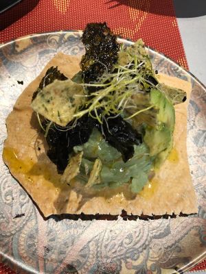 Russian salad with spirulina, avocado, potatoes and seaweed on flat bread at Purpura Project in Alicante