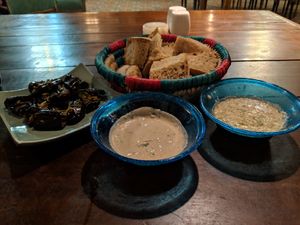 Stuffed eggplant, dips and bread at Sofra in Luxor