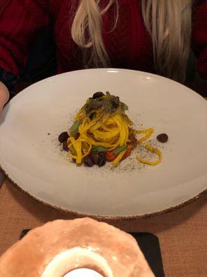 Carrot tagliatelle on a spicy tomato sauce with olives at Seiperdue in Rome