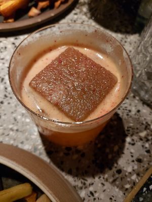 Maracuyá sour, bourbon, aperitivo liviano, cordial de pomelo rojo. at SACRO in Buenos Aires