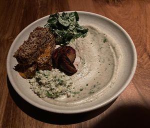 Quinoa tempeh, roasted plum, hummus, risotto, salad at SACRO in Buenos Aires