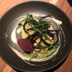 Spinach ravioli with almond ricotta, peas cream and soubise  at SACRO in Buenos Aires