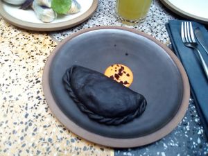 Empanada de carbón activado at SACRO in Buenos Aires