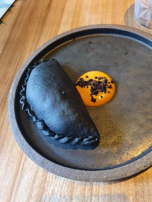 Black empanada at SACRO in Buenos Aires