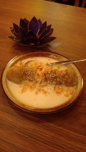 Deep fried banana dessert with almonds and sesame, in a coconut sauce at Quan Xanh in Leipzig