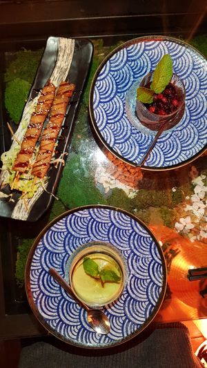 Yakitori, Mousse au chocolat with berries, Avocado cheesecake at Secret Garden in Berlin